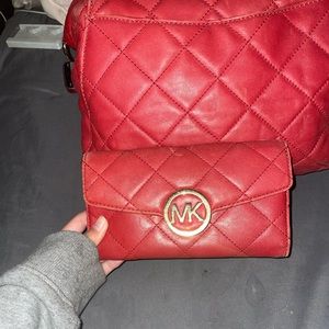 Red Micheal Kors handbag with matching wallet